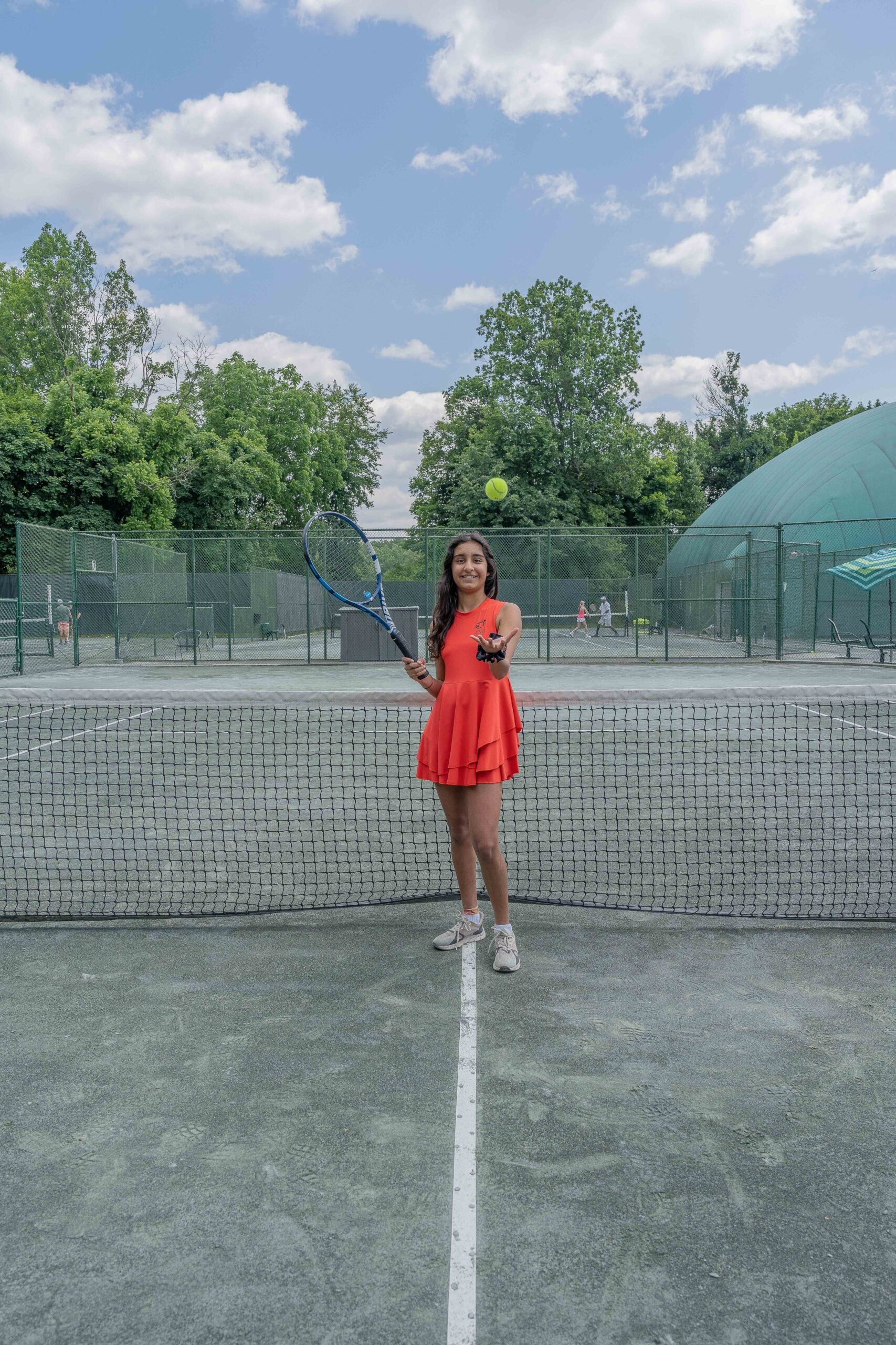 Illustration of a young girl in a Love U Bunches tennis dress