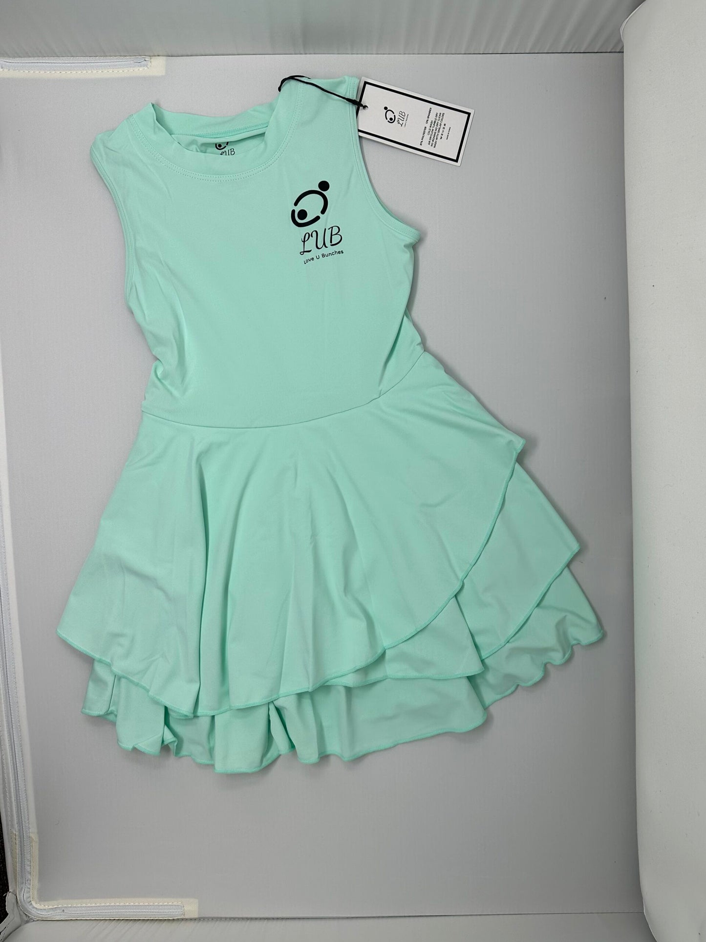 Love U Bunches tennis dress with a stylish racerback, offering flexibility and support.